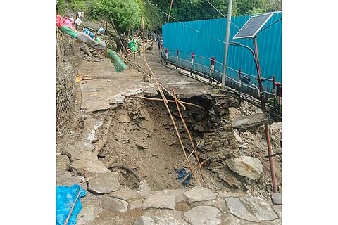 A damaged road at Junglechatti after Cloudburst 